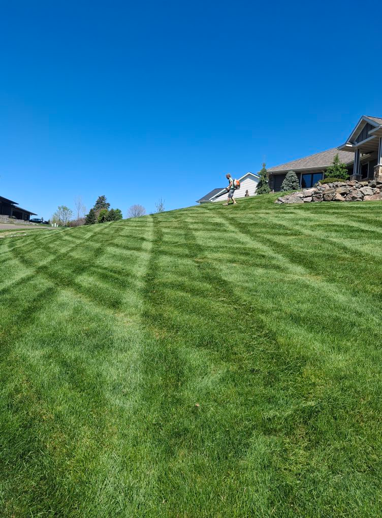 Garbers & Sons crew mowing lawn in Eau Claire WI
