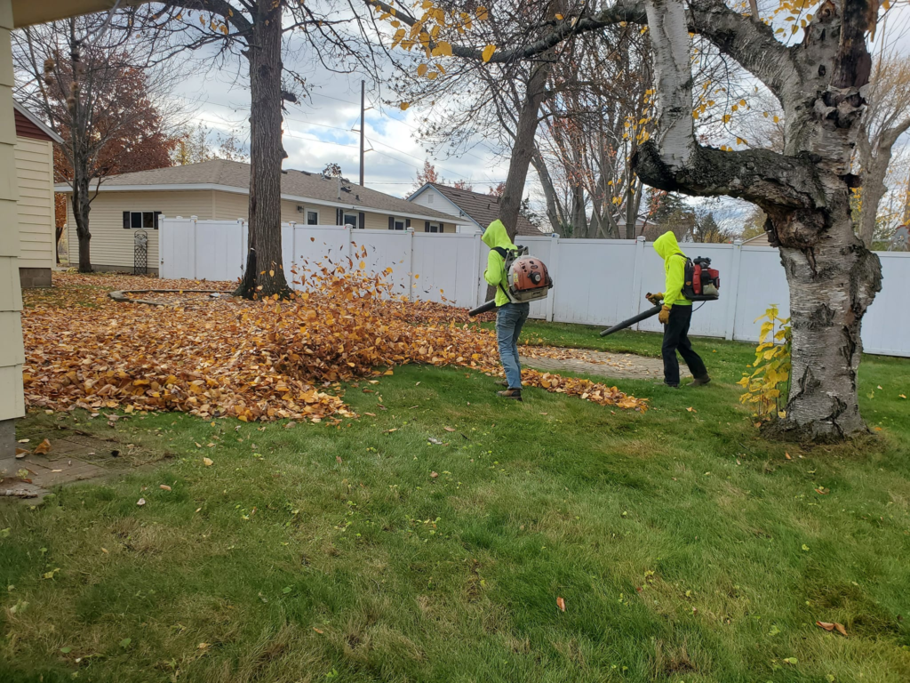 Leaf cleanup crew removing debris Eau Claire WI