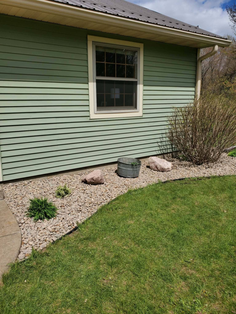 Professional river rock installation in Eau Claire, WI
